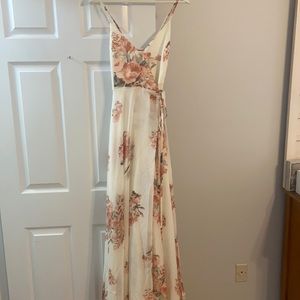 Never been worn. Tags still on. Size M Lulu’s wrap dress. Slit in the front.